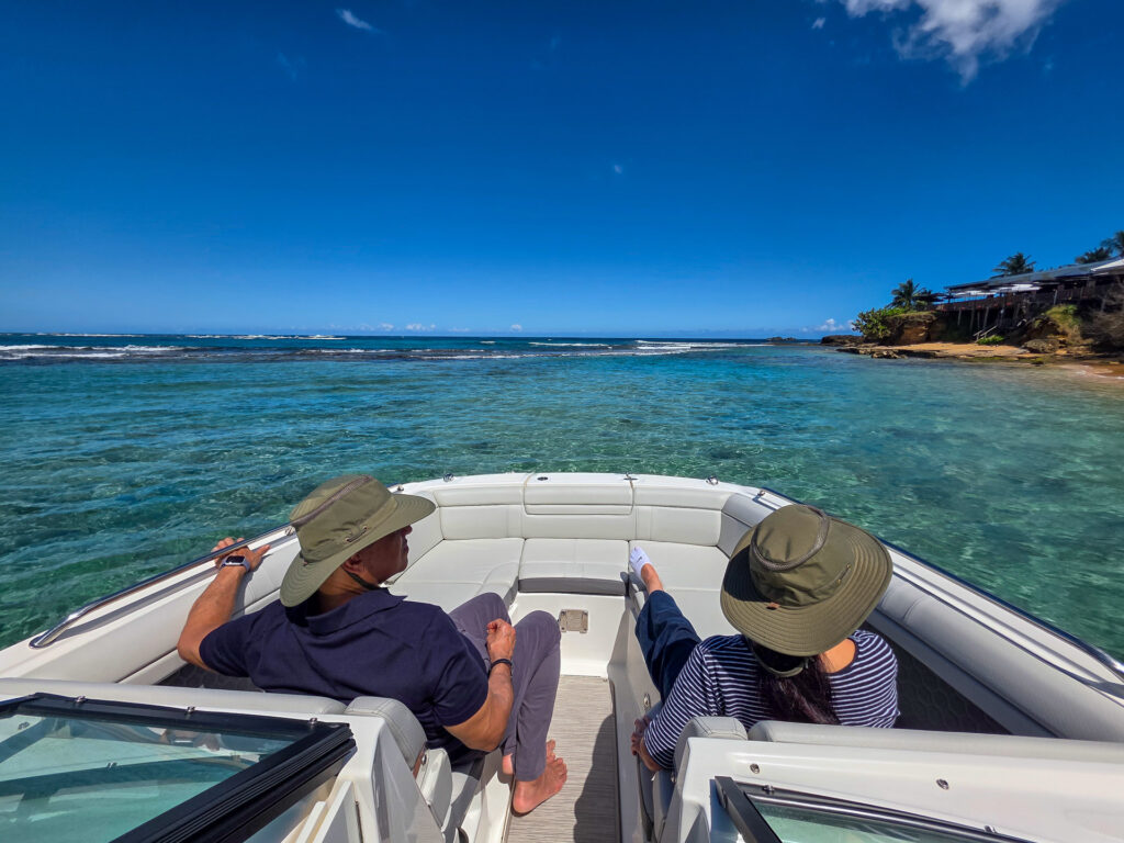 Couple on a dry boat tour over clear reef water near the San Juan airport