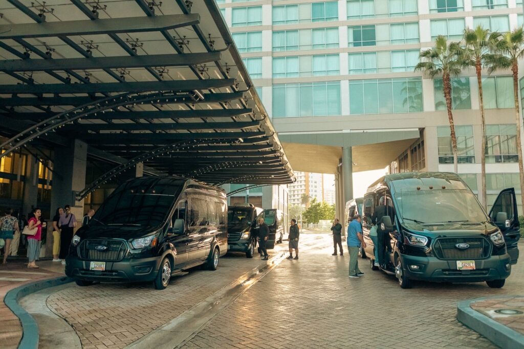 Our van picking up guests at a San Juan hotel for an airport transfer and boat tour