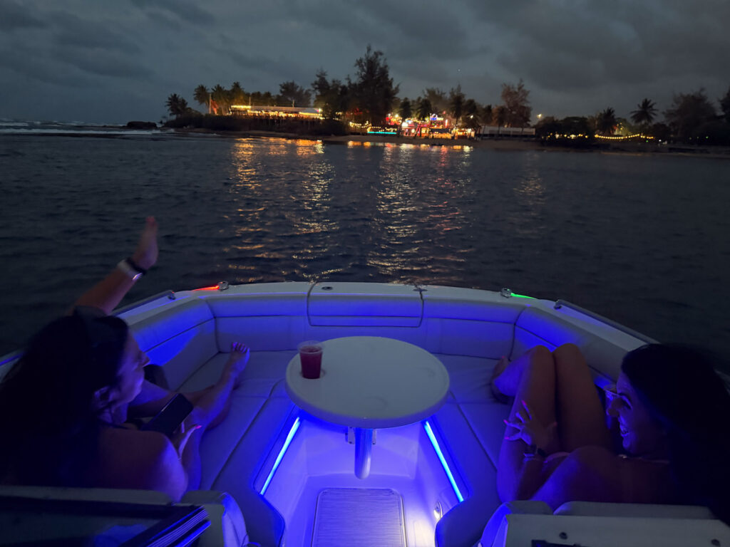 Night boat cruise with LED lights and the city lights of San Juan, Puerto Rico