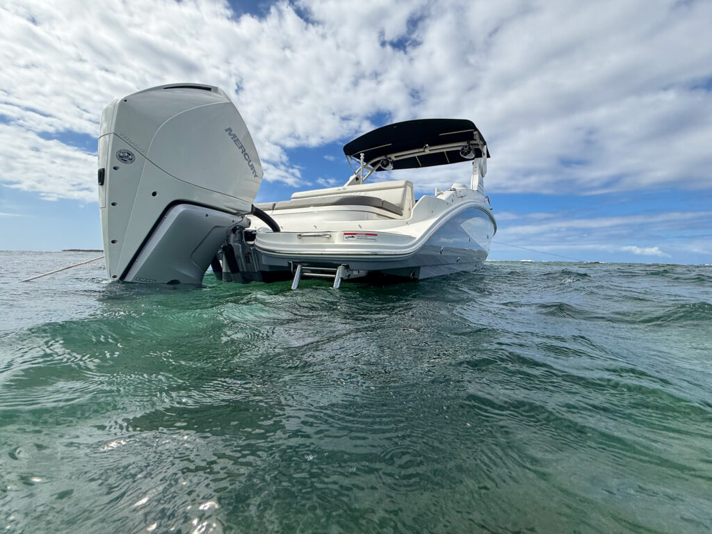 Sea Ray SDX 270 with white Mercury 300 outboard anchored off Puerto Rico