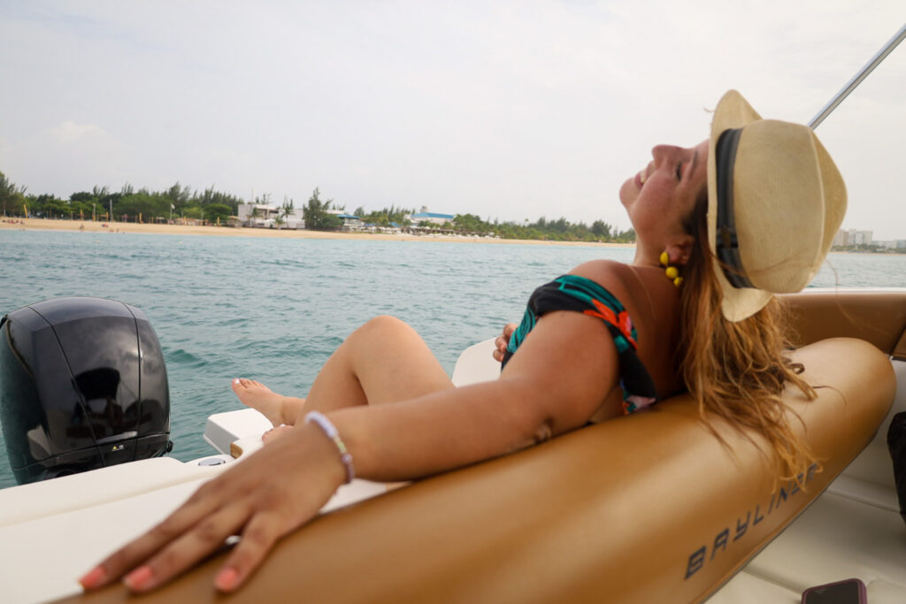 Woman sun hat bayliner stern San Juan Puerto Rico copy – Oceania Boat Tours & Charters